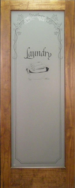Laundry room door has "Laundry" etched in glass panel.  Shown here in a stained pine frame.