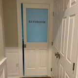 Bathroom door in half lite frame
