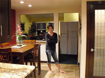 Modern interior pantry door stained dark brown to match kitchen cabinets.