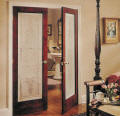 French doors with elegant etched glass design used to brighten up the room.